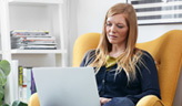 A woman working on PC