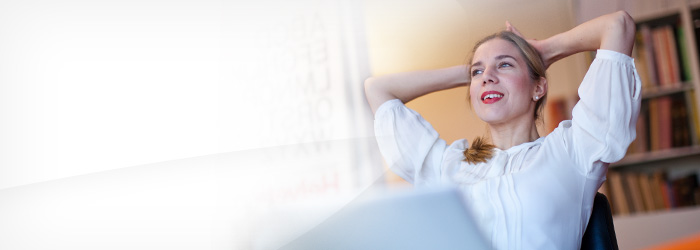 woman leaning back by computer