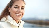 Woman outdoors in white jacket